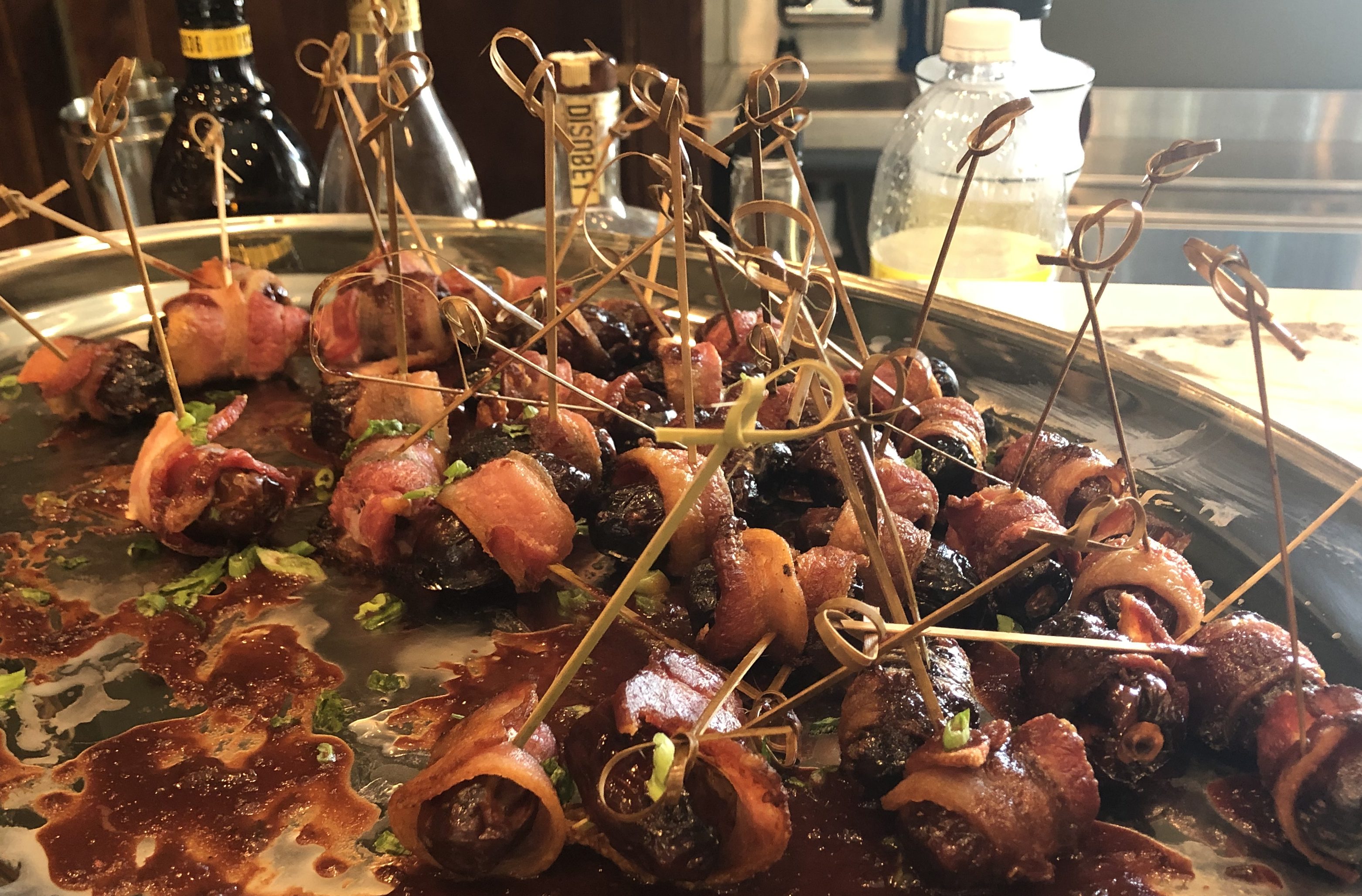 Bacon wrapped dates drizzled with chocolate